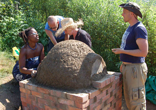 woking on a cob oven